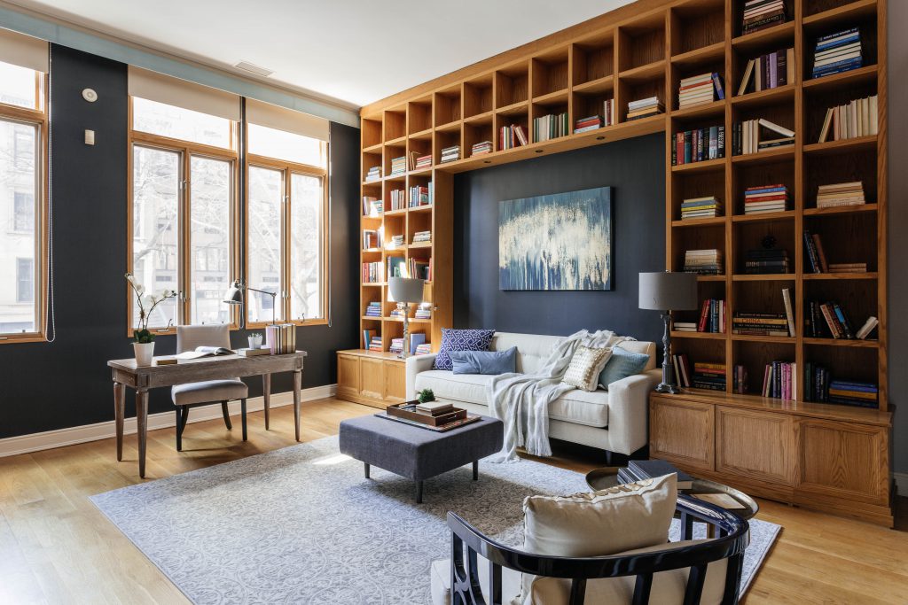 large library with wooden bookshelves and home office